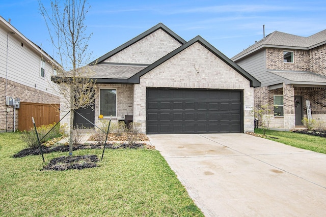 4984 Pismo Ray Dr, Katy, TX 77493 - french provincial home featuring a front yard, concrete driveway, fence, a shingled roof, and a garage