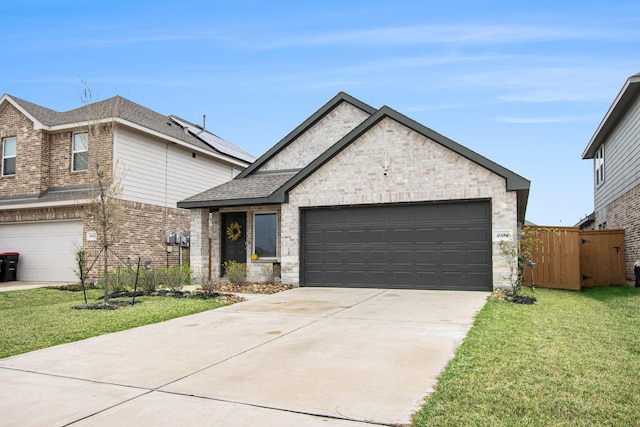 4984 Pismo Ray Dr, Katy, TX 77493 - view of front of home featuring brick siding, a shingled roof, concrete driveway, and a front yard