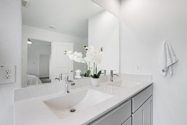 4984 Pismo Ray Dr, Katy, TX 77493 - ensuite bathroom featuring double vanity, visible vents, and a sink