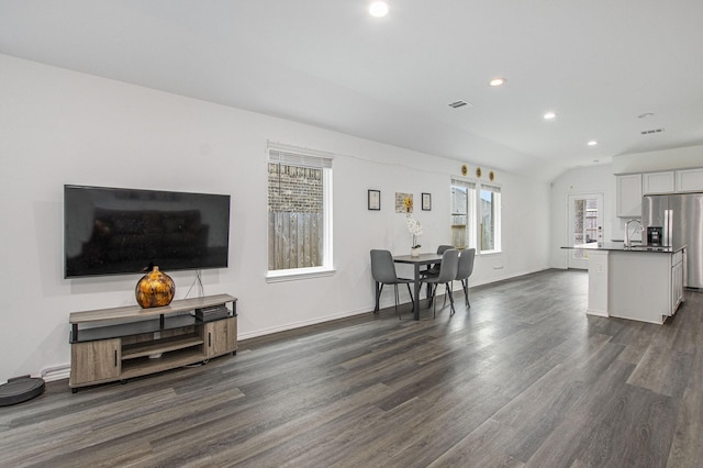 4984 Pismo Ray Dr, Katy, TX 77493 - living room with vaulted ceiling, dark wood-type flooring, baseboards, visible vents, and recessed lighting