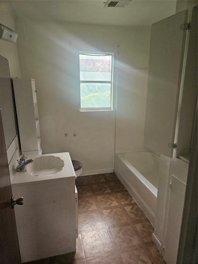 112 N Parrish St, Angleton, TX 77515 - bathroom featuring vanity, toilet, and baseboards