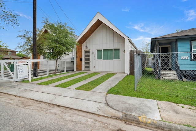 shotgun-style home featuring board and batten siding