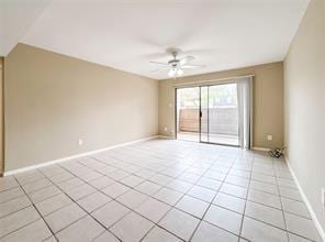 spare room featuring baseboards, ceiling fan, and light tile patterned floors