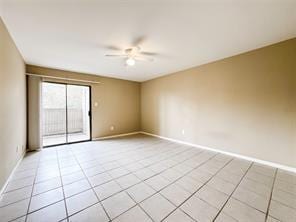 unfurnished room featuring light tile patterned flooring, baseboards, and ceiling fan