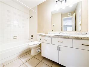 full bath featuring toilet, vanity, shower / bathing tub combination, and tile patterned flooring