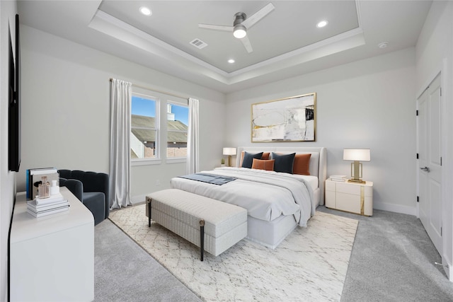bedroom with visible vents, carpet floors, recessed lighting, and a raised ceiling