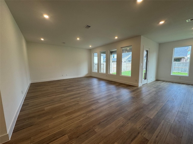 31319 Hastings Creek Ln, Fulshear, TX 77441 - empty room featuring healthy amount of natural light, dark wood finished floors, and recessed lighting