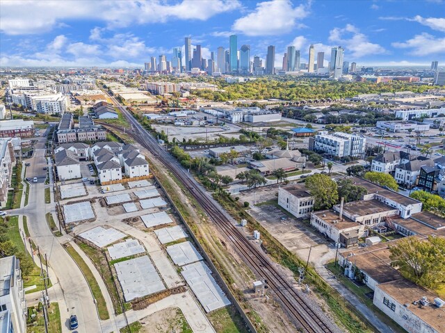 birds eye view of property featuring a city view