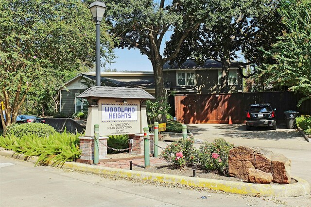 exterior space featuring driveway and fence