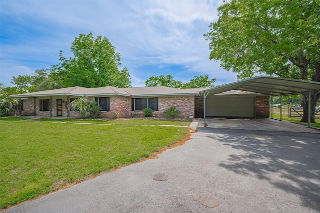 26003 Fountaine Bleau Dr, Tomball, TX 77377 - single story home featuring asphalt driveway, a front lawn, a garage, and brick siding