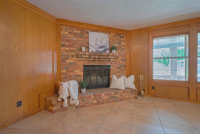 26003 Fountaine Bleau Dr, Tomball, TX 77377 - unfurnished living room with a textured ceiling, wood walls, and a fireplace