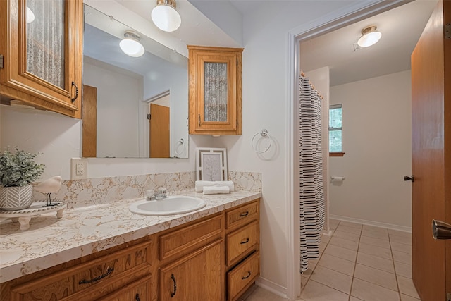 26003 Fountaine Bleau Dr, Tomball, TX 77377 - full bath featuring vanity, tile patterned flooring, and baseboards