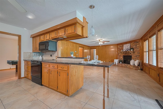 26003 Fountaine Bleau Dr, Tomball, TX 77377 - kitchen featuring black appliances, ceiling fan, a brick fireplace, backsplash, and brown cabinets