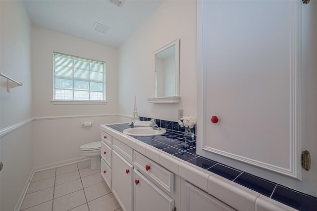 26003 Fountaine Bleau Dr, Tomball, TX 77377 - bathroom with toilet, tile patterned floors, vanity, and baseboards