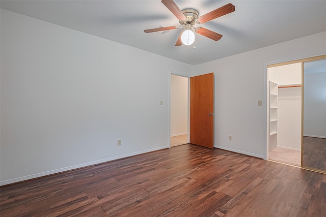 26003 Fountaine Bleau Dr, Tomball, TX 77377 - unfurnished bedroom with wood finished floors, baseboards, and a closet