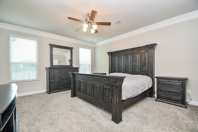 bedroom with multiple windows, visible vents, light carpet, and ornamental molding