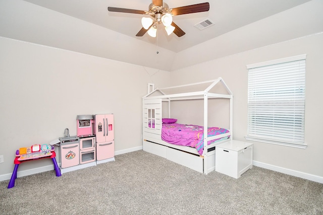 bedroom with carpet flooring, visible vents, baseboards, lofted ceiling, and ceiling fan
