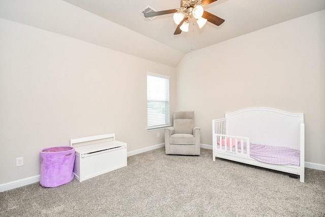 bedroom with vaulted ceiling, carpet floors, baseboards, and ceiling fan