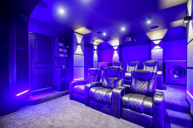 home theater featuring carpet flooring and visible vents