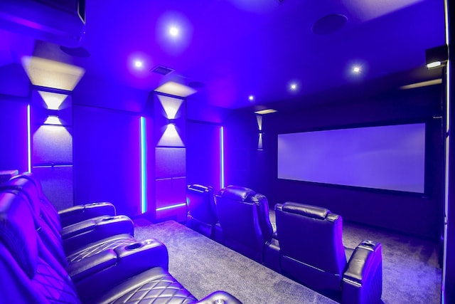 carpeted cinema room with recessed lighting and visible vents