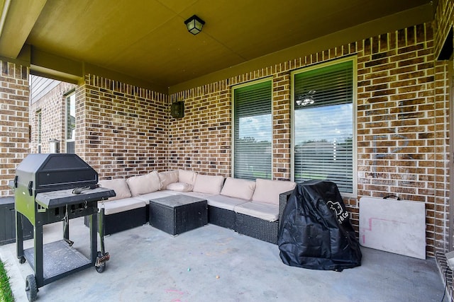 view of patio with outdoor lounge area and a grill