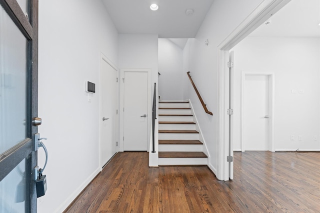 staircase with wood finished floors