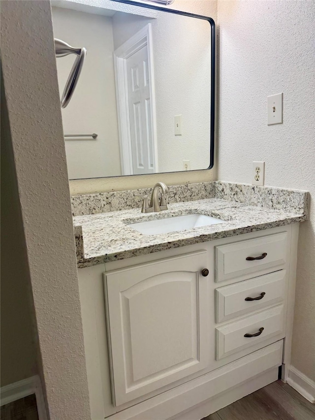 2750 Holly Hall St Unit 1301, Houston, TX 77054 - bathroom featuring vanity and wood finished floors