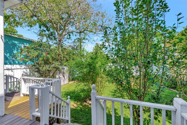 wooden deck with fence and a yard