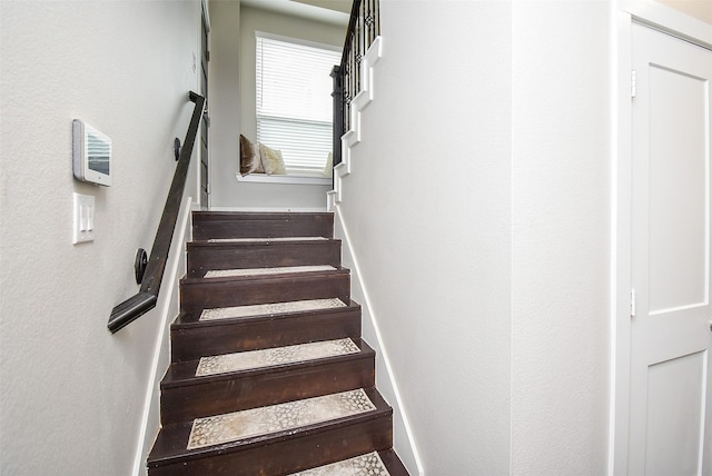 staircase with baseboards