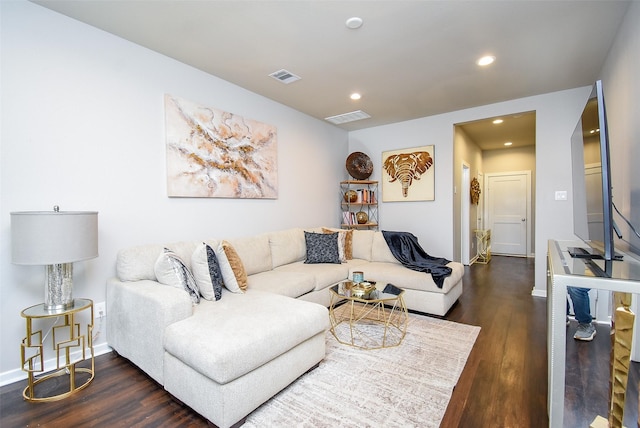 living area featuring wood finished floors, recessed lighting, baseboards, and visible vents