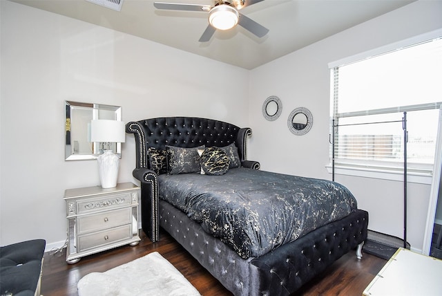 bedroom with wood finished floors and a ceiling fan