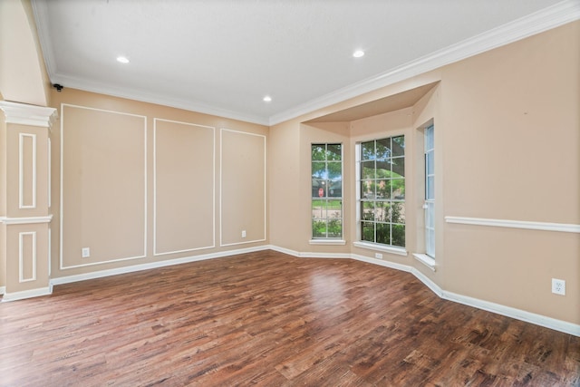 spare room with crown molding, recessed lighting, baseboards, and wood finished floors