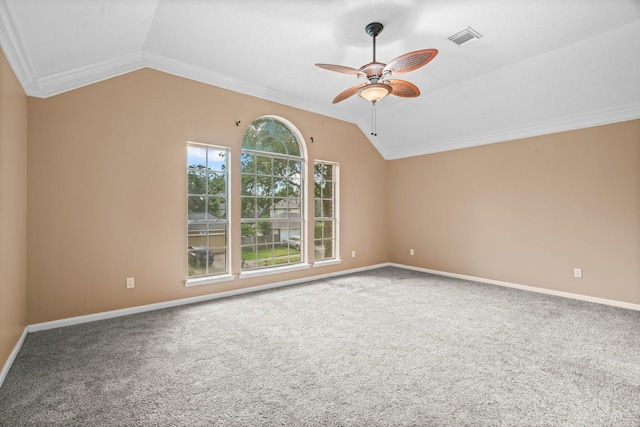 unfurnished room with visible vents, lofted ceiling, baseboards, a ceiling fan, and carpet