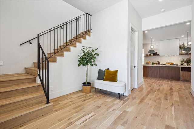 519 Milwaukee St, Houston, TX 77009 - staircase featuring recessed lighting, baseboards, and wood finished floors