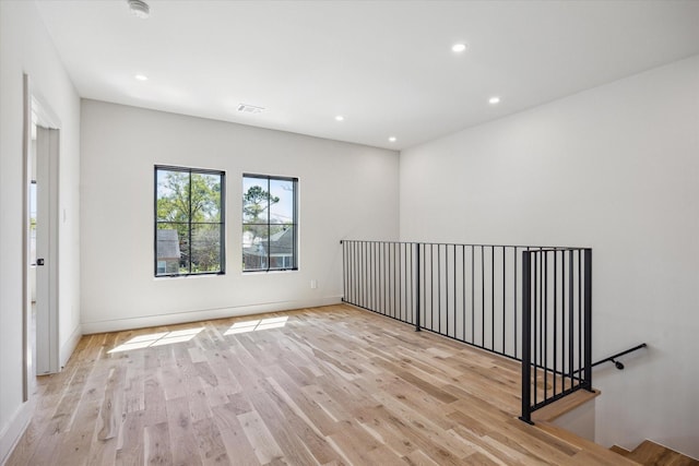 519 Milwaukee St, Houston, TX 77009 - empty room featuring baseboards, visible vents, wood finished floors, and recessed lighting