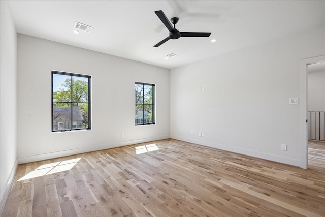 519 Milwaukee St, Houston, TX 77009 - unfurnished room with a ceiling fan, light wood finished floors, baseboards, visible vents, and recessed lighting