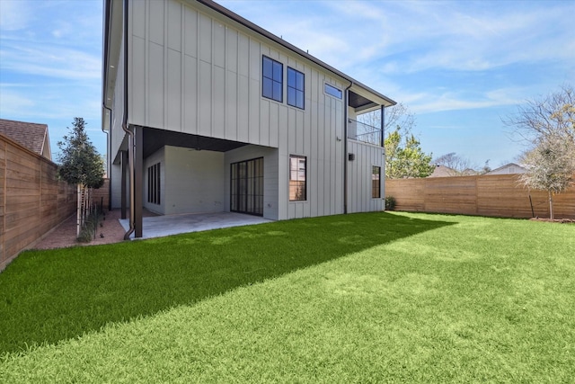 519 Milwaukee St, Houston, TX 77009 - back of property featuring a patio, a fenced backyard, board and batten siding, and a yard