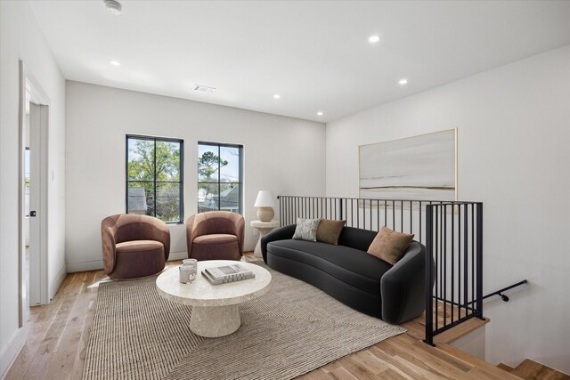 519 Milwaukee St, Houston, TX 77009 - living room with light wood-style flooring, visible vents, and recessed lighting