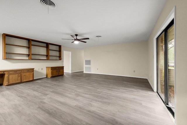 unfurnished living room featuring baseboards, ceiling fan, visible vents, and light wood-style floors