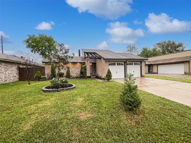 view of front of house with a garage, a front lawn, and concrete driveway