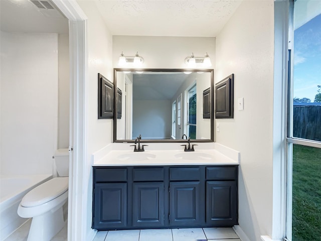 full bath featuring toilet, a sink, double vanity, and visible vents