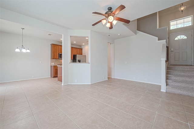13600 Breton Ridge St Unit 22D, Houston, TX 77070 - unfurnished living room featuring light tile patterned flooring, ceiling fan, stairway, and recessed lighting
