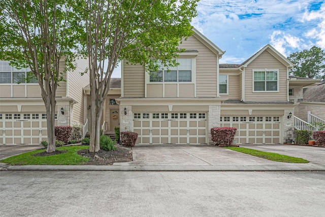13600 Breton Ridge St Unit 22D, Houston, TX 77070 - view of front facade featuring a garage and concrete driveway