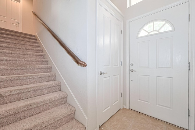 13600 Breton Ridge St Unit 22D, Houston, TX 77070 - foyer entrance with stairs and light tile patterned flooring