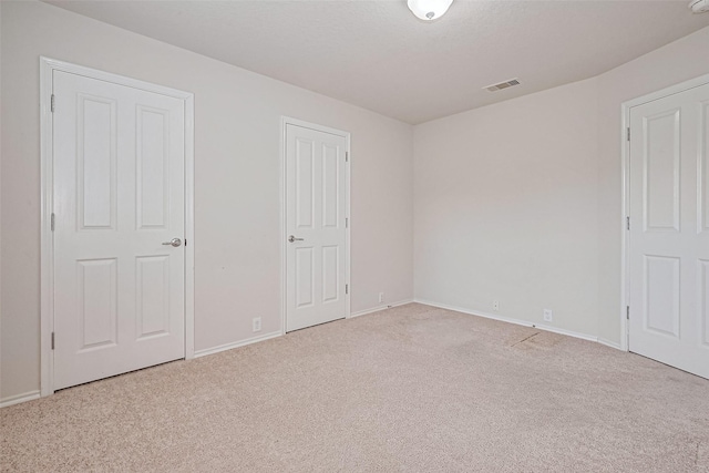 13600 Breton Ridge St Unit 22D, Houston, TX 77070 - unfurnished bedroom with carpet floors and baseboards