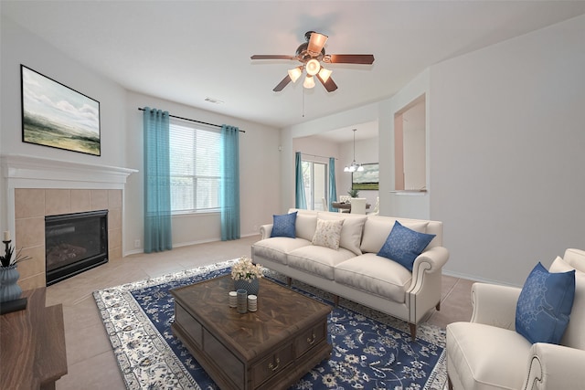 13600 Breton Ridge St Unit 22D, Houston, TX 77070 - tiled living room featuring ceiling fan, a tile fireplace, and baseboards