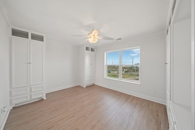 20919 W Sunset Bay Dr, Galveston, TX 77554 - unfurnished bedroom featuring light wood-type flooring, ornamental molding, and a ceiling fan