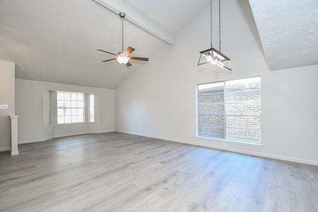 15827 Tammany Ln, Houston, TX 77082 - unfurnished living room featuring ceiling fan with notable chandelier, beamed ceiling, light wood-style flooring, and baseboards