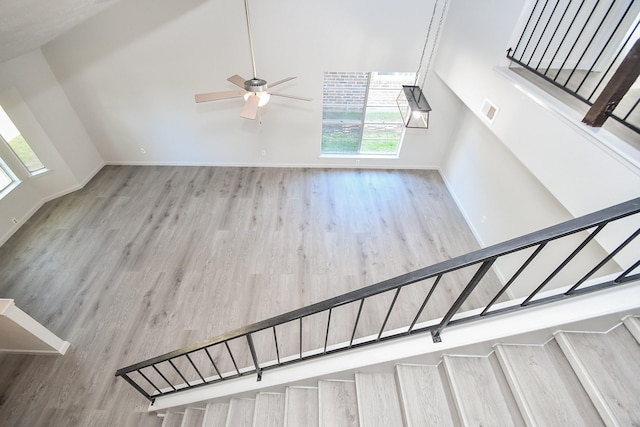 15827 Tammany Ln, Houston, TX 77082 - stairway featuring a ceiling fan, visible vents, baseboards, and wood finished floors