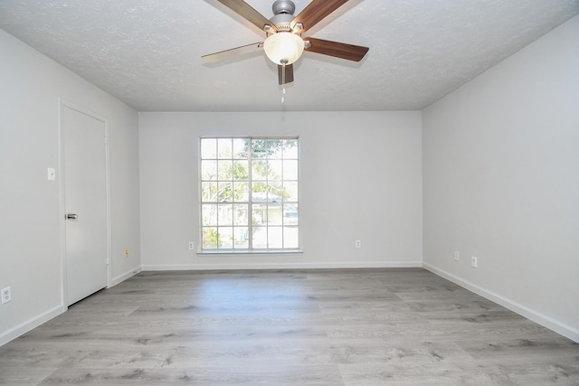 15827 Tammany Ln, Houston, TX 77082 - empty room featuring a textured ceiling, baseboards, ceiling fan, and wood finished floors